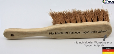 Hand brush with coconut placement